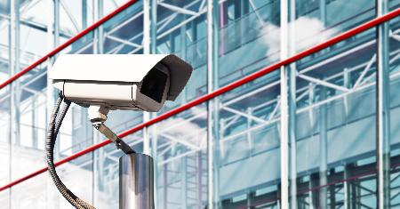 A security camera in front of a building 